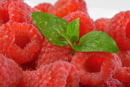 detail of fresh raspberries with leaves