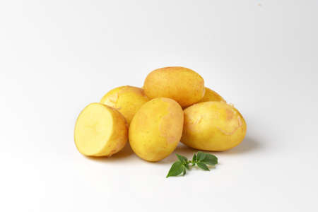 heap of unpeeled new potatoesの写真素材