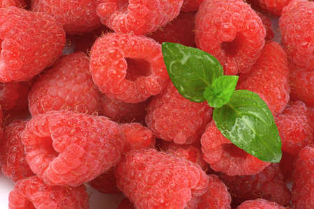 detail of fresh raspberries with leaves