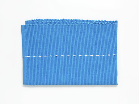 Blue woven cotton placemat folded twice