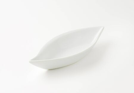 empty deep curved white bowlの写真素材