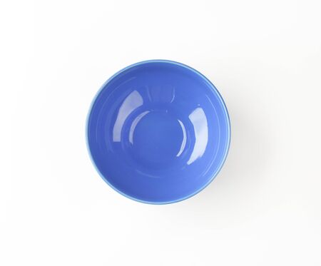 empty blue ceramic bowl on white backgroundの写真素材
