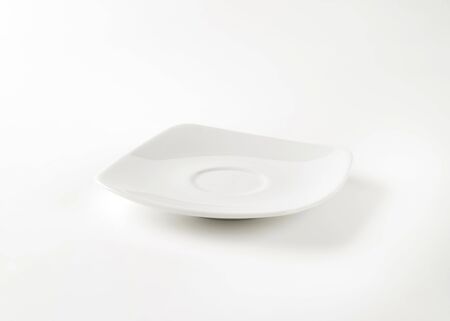 empty square white saucer on white backgroundの写真素材