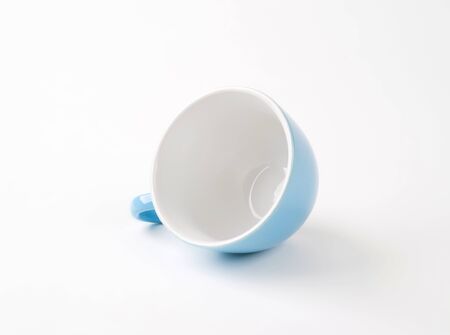 blue tea cup on white backgroundの写真素材
