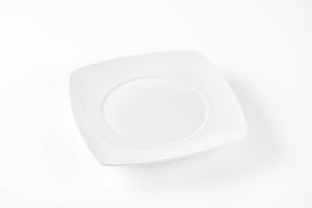 white square plate with wide rimの写真素材