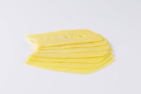 thin slices of emmental cheeseの写真素材