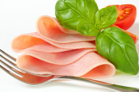 Studio shot of thinly sliced hamの写真素材