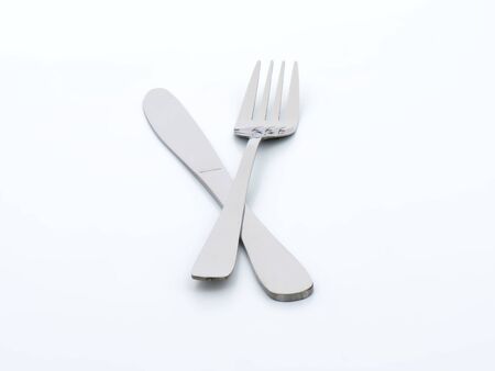 knife and fork on white backgroundの写真素材