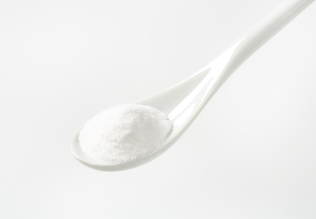 cooking soda on white spoonの写真素材