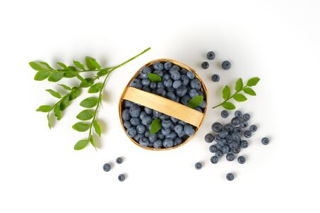 Fresh picked blueberries in wood chip basketの写真素材