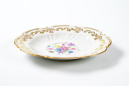 antique plate with floral pattern and decorative rimの写真素材