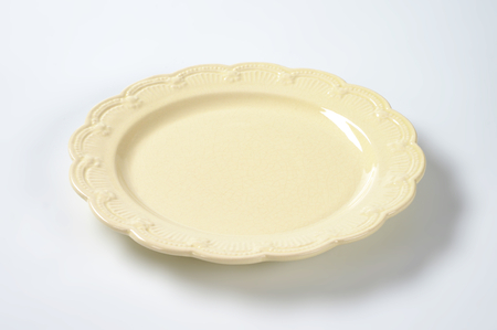 beige plate with embossed rimの写真素材