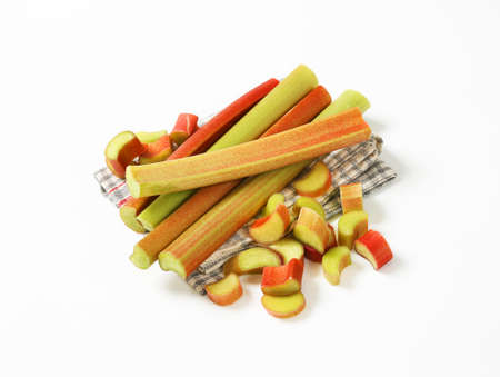 fresh rhubarb stems on dish towelの写真素材