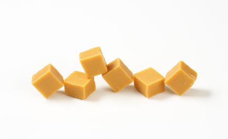 Chewy toffee candies on white backgroundの写真素材