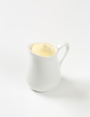 Semolina flour in a white jugの写真素材