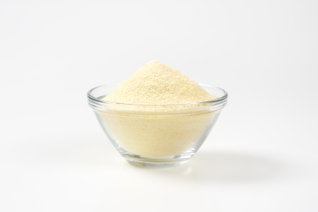 Heap of semolina flour in a glass bowlの写真素材