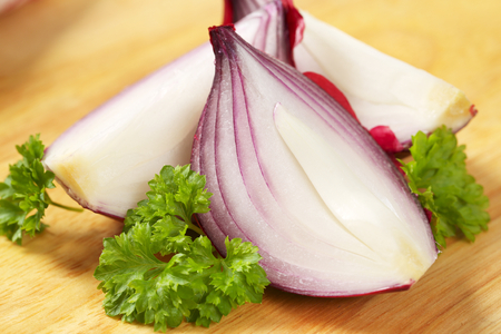 red onion cut into wedgesの写真素材