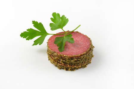 thin sliced salami coated in coarsely ground green peppercorns