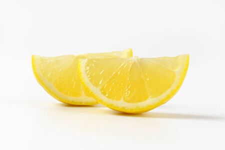 fresh lemon slices on white backgroundの写真素材