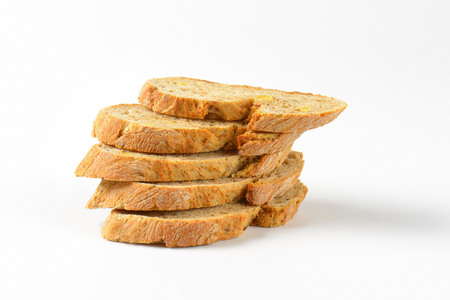 stack of wholegrain bread slices on white backgroundの写真素材