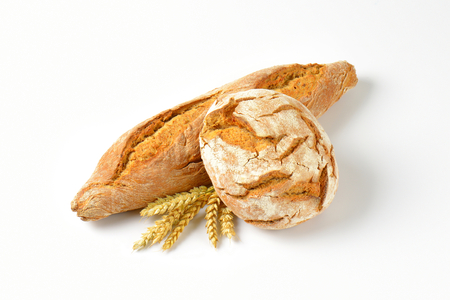 freshly baked bread and baguette on white backgroundの写真素材