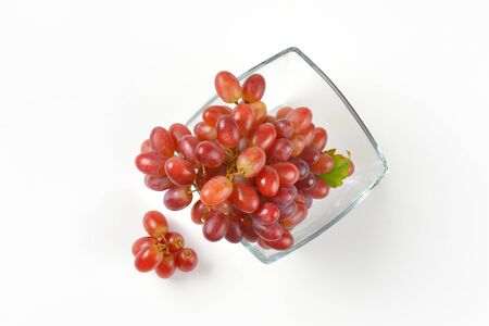 bunch of red grapes in glass bowlの写真素材