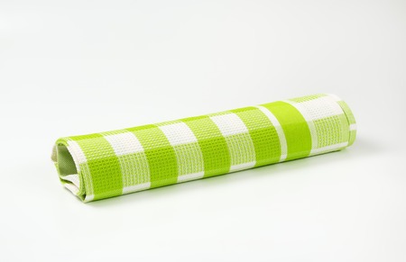 green and white checkered tea towel on white backgroundの写真素材