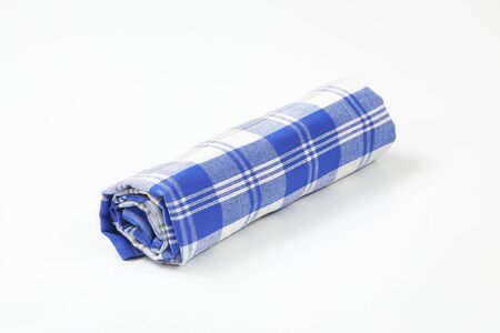 blue and white checkered dish towel on white backgroundの写真素材