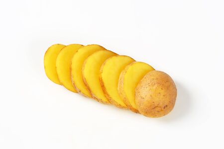 sliced raw potato on white backgroundの写真素材
