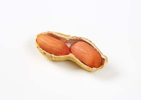 peanuts in their shell on white background