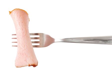thin slice of smoked pork on forkの写真素材