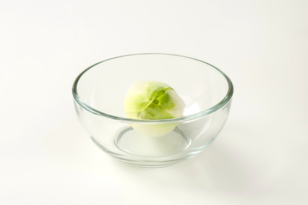 fresh Belgian endive head (Witloof chicory) in glass bowlの写真素材