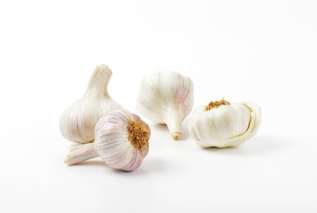 Fresh garlic bulbs on white background