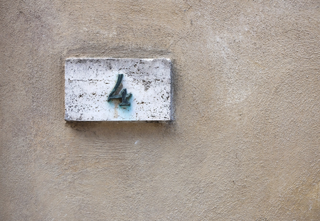 House number on a weathered wallの写真素材