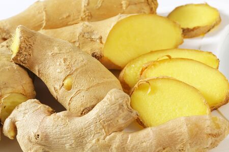 Fresh ginger root, sliced - closeup