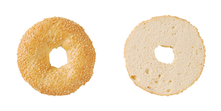 halved bagel with sesame seeds on white backgroundの写真素材