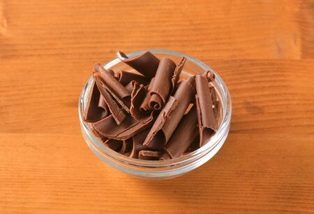 Chocolate curls in a glass bowlの写真素材