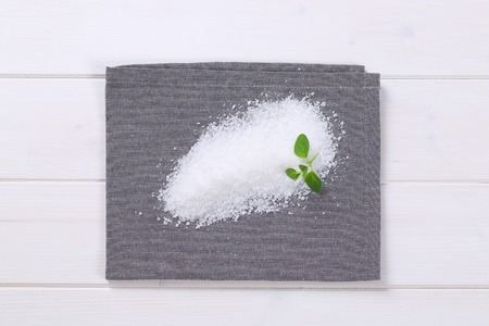 pile of coarse grained sea salt on grey place matの写真素材