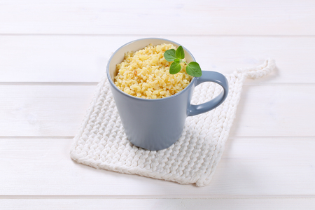 Cooked whole groats  in a cupの写真素材