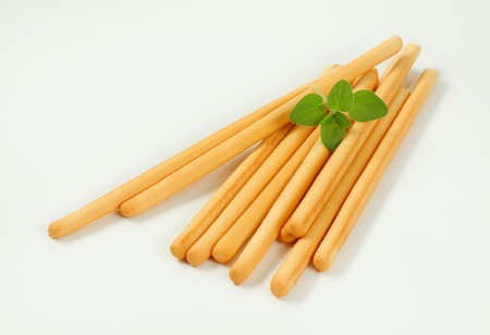crispy bread sticks on white background