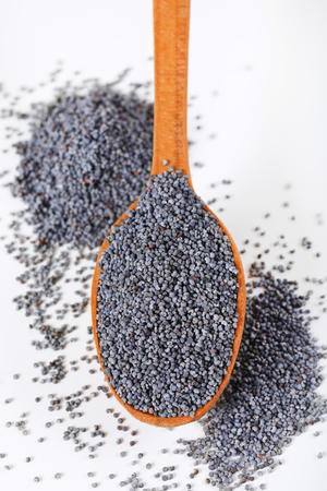 spoon of whole poppy seedsの写真素材