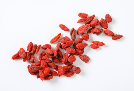 handful of goji berries on white backgroundの写真素材