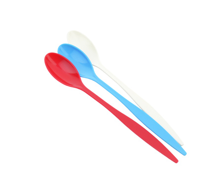 Three empty long plastic spoons - red, blue and whiteの写真素材