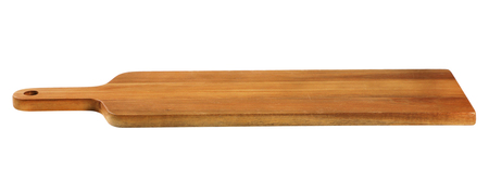 narrow wooden cutting board with handle on white backgroundの写真素材