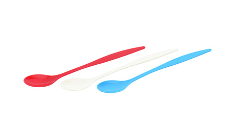 Three empty long plastic spoons - red, blue and whiteの写真素材
