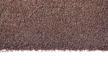 ground poppy seeds on white backgroundの写真素材
