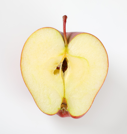half of red apple on white backgroundの写真素材