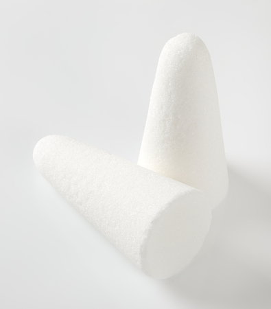 two white sugar loaves or cones on white backgroundの写真素材