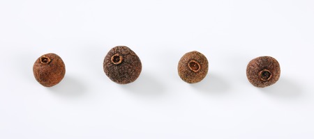 whole allspice berries on white backgroundの写真素材