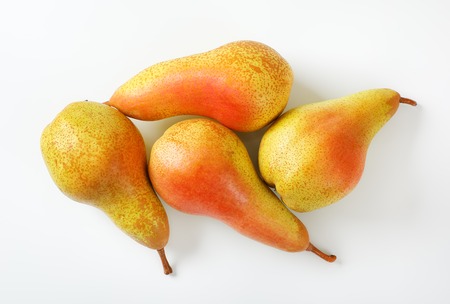 four ripe pears on white backgroundの写真素材